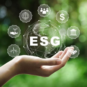 ESG icon concept in the hand for environmental, social, and governance in sustainable and ethical business on the Network connection on a green background.
